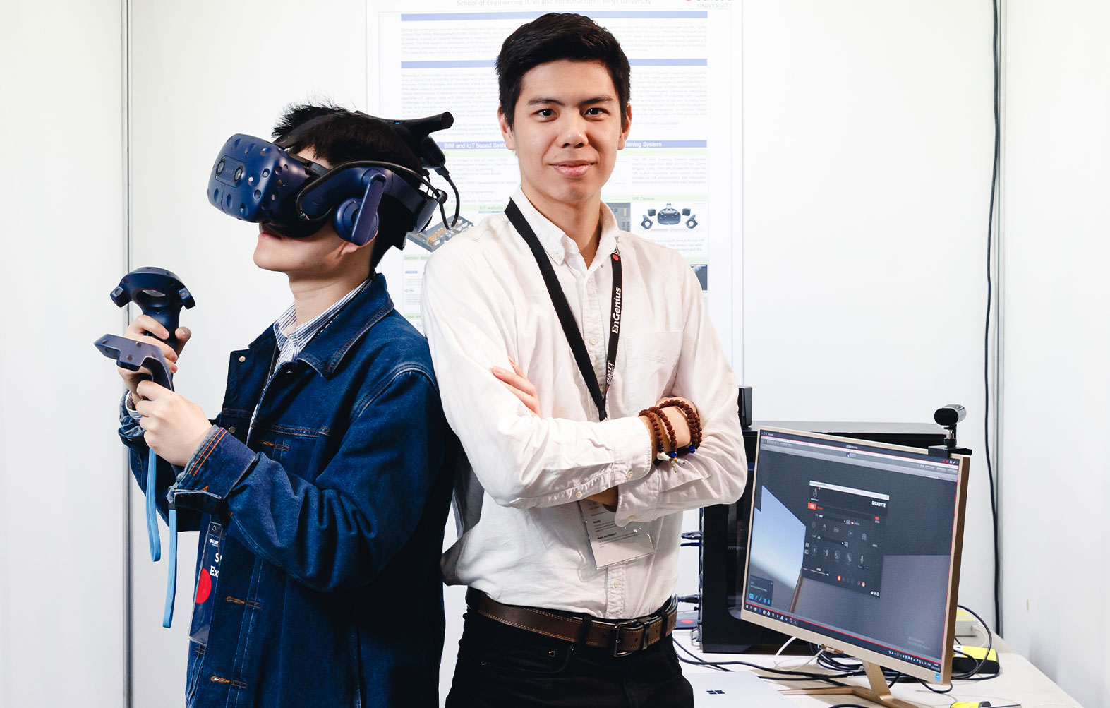 Two people standing with VR machine