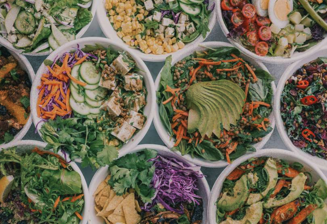 Bowls of food, displayed beautifully full of vegetables.