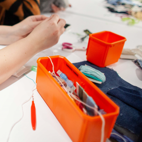Table with sewing and crafting tools.