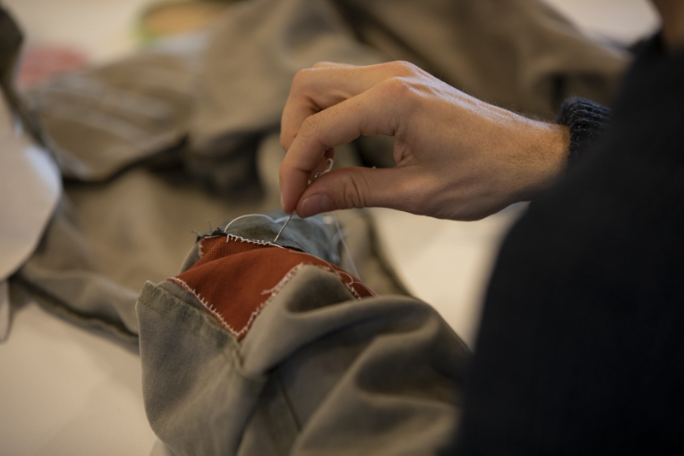 Patch work stitching on clothes.